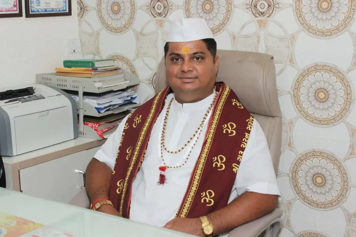 Jyotishi Kirtibhai at his consulting desk